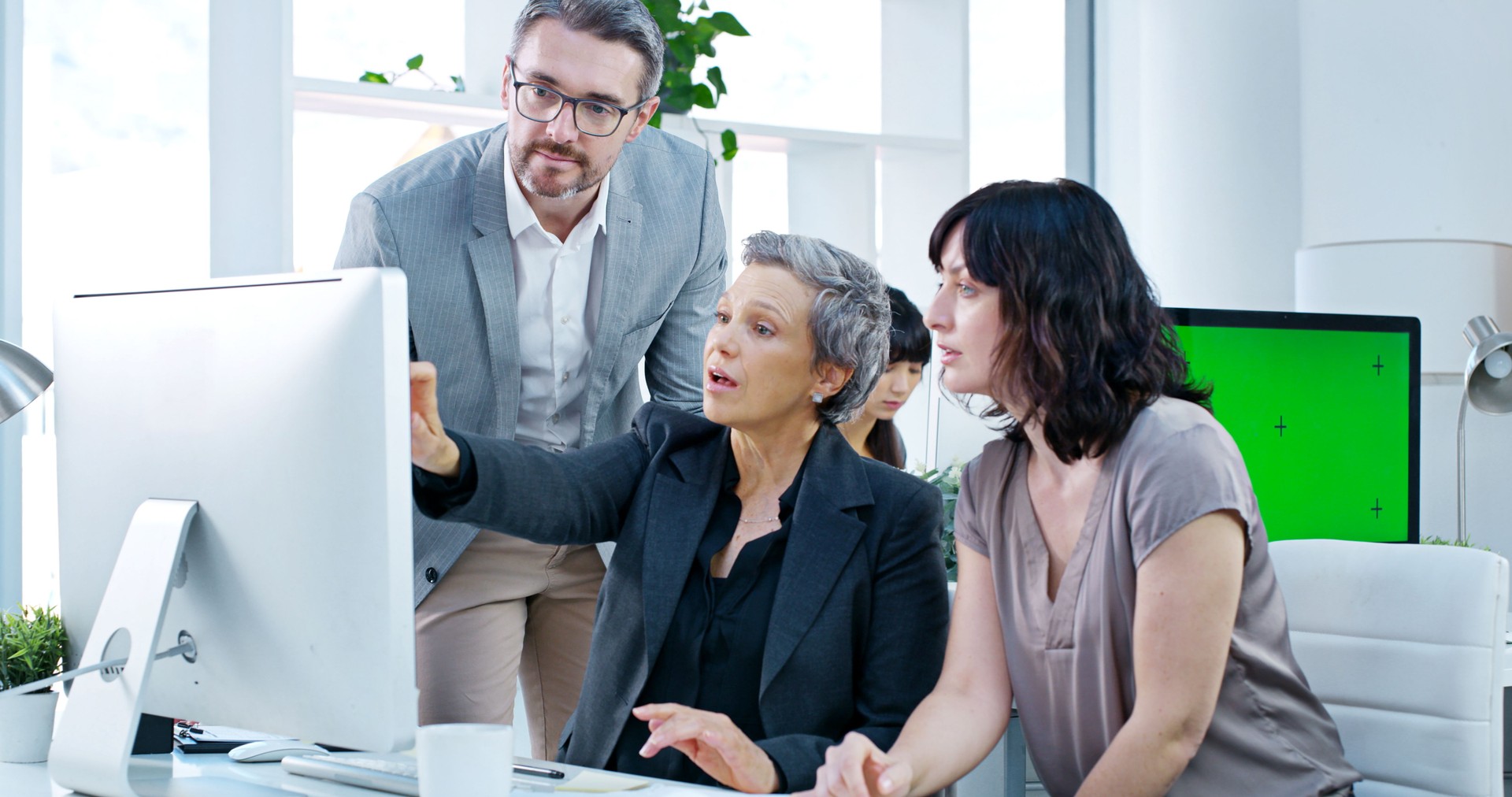 Collaboration, computer and project management with business people in office together for training. Feedback, pointing and teaching with corporate employee group in workplace for development